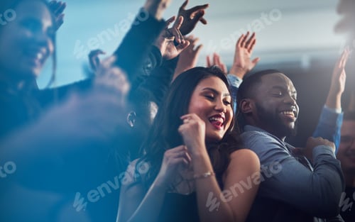 Preview: Cropped shot of an energetic young couple dancing together at a party at night