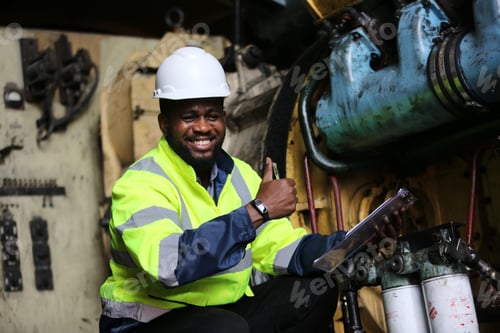 Preview: Man engineer standing on construction site or equipment maintenance work site.