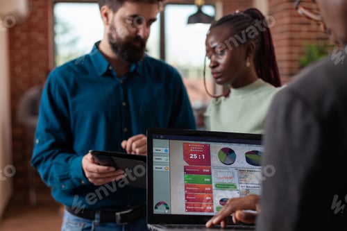 Preview: Diverse businesspeople analyzing company turnover