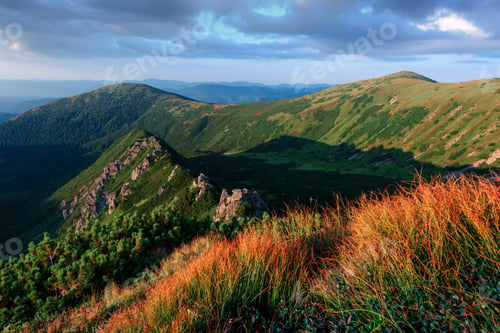 Preview: View of the stony hills glowing by evening sunlight