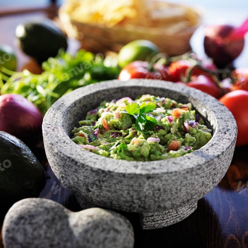 Preview: mexican guacamole in stone molcajete