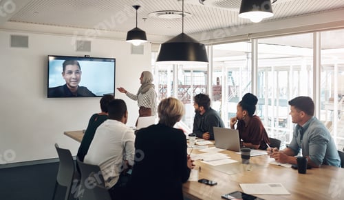 Preview: Cropped shot of a group of business colleagues gathered in the boardroom for a video conference