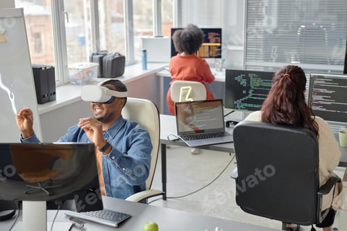 Preview: Programmer at Workplace in Virtual Reality Company