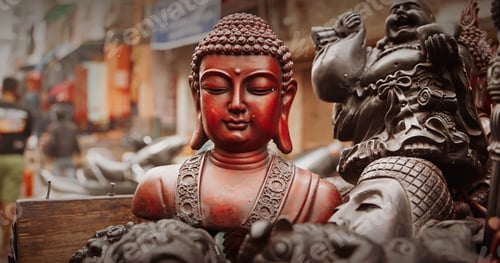 Preview: Souvenirs statues of Buddha head on flea market in Delhi, India. Buddha and other Indian gods