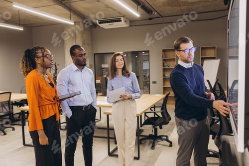 Preview: Diverse group of professionals engaged in a collaborative discussion in a modern office environment