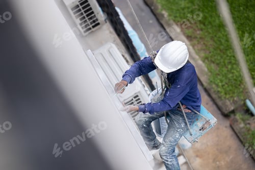 Preview: Exterior paint and leak repair technician builder, rope rappelling to repair buildings outside wall