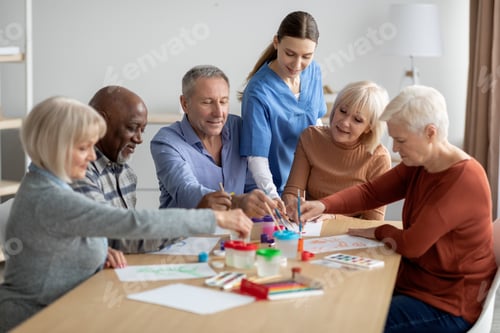 Preview: International group of senior people having painting activity