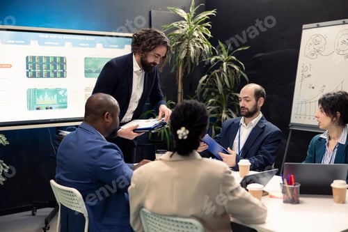 Preview: Diverse business colleagues examining market trends using their finances papers