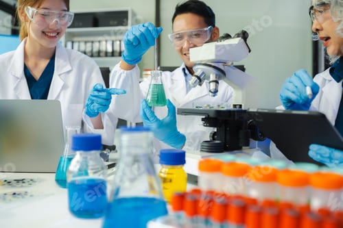 Preview: Scientist mixing chemical liquids in the chemistry lab.