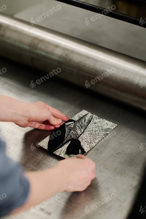 Preview: Hands of artisan using printing machine