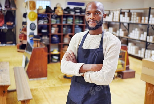 Preview: Shot of a young man working at his job in a shop