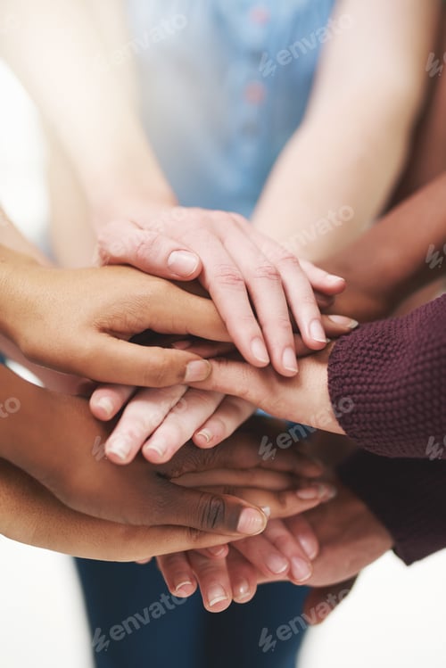 Preview: Strength in numbers. Cropped shot of a group people putting their hands together in unity.