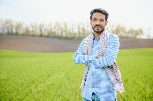 Preview: worry less ,indian farmer standing in his healthy wheat field
