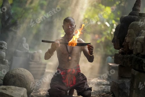 Preview: Fire performer showcases skill in tranquil outdoor setting among ancient sculptures