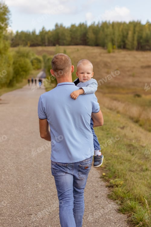 Preview: Father and Child Walking Along Rural Path