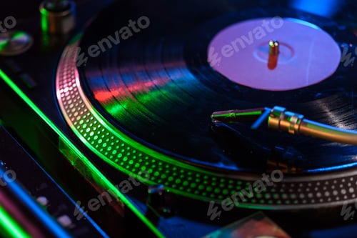 Preview: close up view of sound mixer with vinyl in nightclub