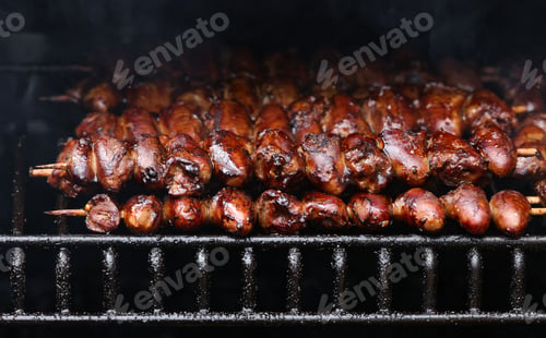 Preview: Smoking chicken yakitori hearts on grill