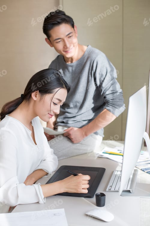 Preview: Young couple designing clothing together