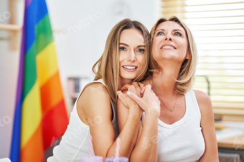 Preview: LGBT Lesbian couple love moments in the kitchen happiness concept