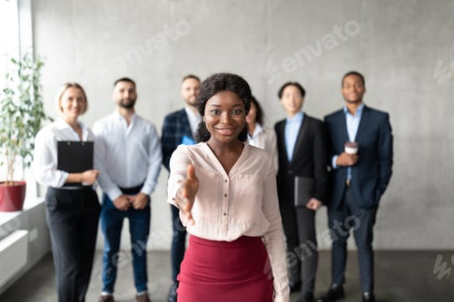 Preview: Black Business Lady Stretching Hand For Handshake In Office
