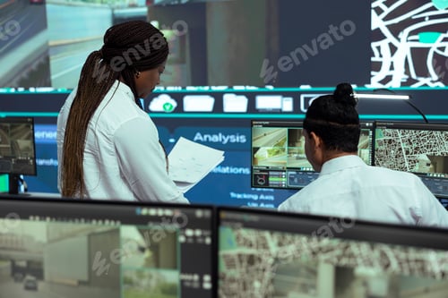 Preview: Manager offers logistics papers to indian employee in observation room