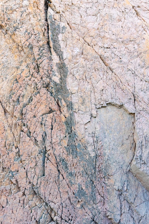 Preview: Rocky background with textured wall in bright light