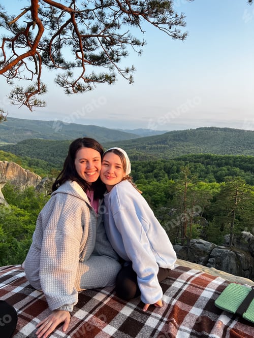 Preview: Two Friends Embrace Enjoying Scenic Mountain View