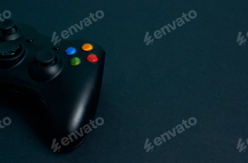 Preview: Close-up video game console controller on a black background