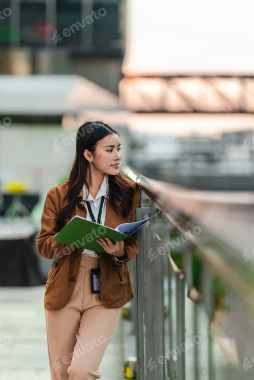Preview: Female Architect Reviewing Plans for Eco-Friendly Building