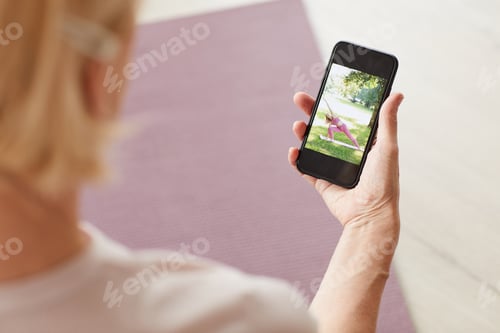 Preview: Woman watching yoga online