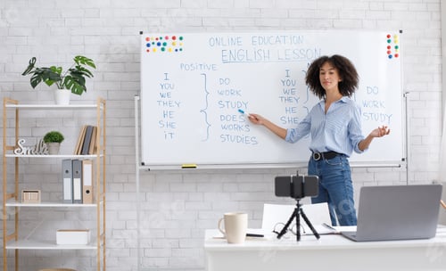 Preview: English teacher online at home. Portrait of african american woman, writing on board in classroom