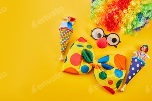 Preview: April Fool's day concept. Clown on yellow background