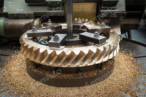 Preview: Bronze worm gear wheel in lathe in engineering factory