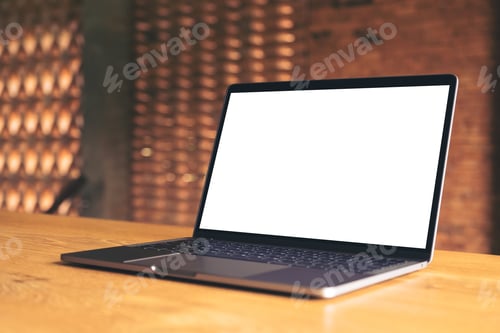 Preview: Mockup image of laptop with blank white desktop screen on wooden table with concrete wall background
