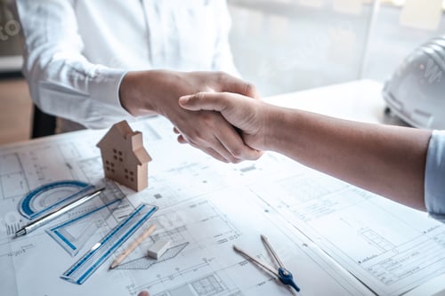 Preview: Team of architects or engineering shaking hands while working cooperation on engineer tools