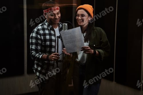 Preview: Portrait of young man and woman, duet looking at lyrics, singing into a condenser microphone