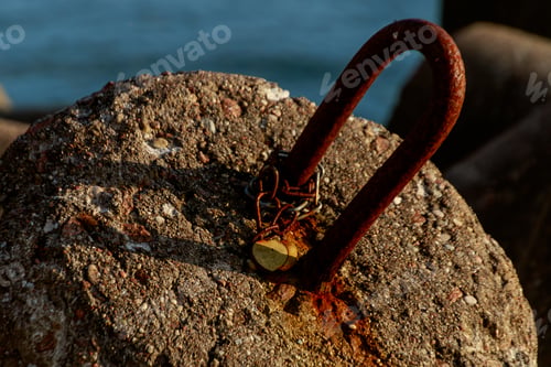 Preview: Closeup shot of a metal rusty lock on the gate to the port of Klaipeda