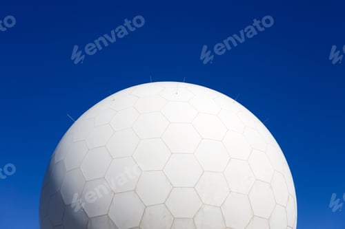 Preview: White Geodesic Dome Against a Vibrant Blue Sky