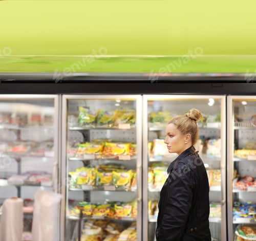 Preview: Woman Choosing Frozen Food From A Supermarket Freezer
