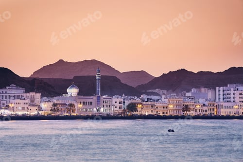 Preview: Cityscape view of Muscat city at golden sunset. The capital of Oman.