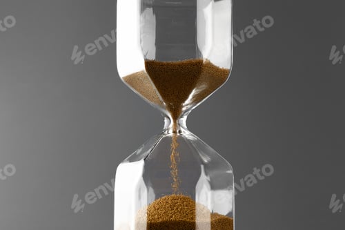 Preview: Hourglass with sand on gray background close up