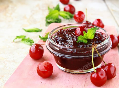 Preview: cherry jam in a jar and fresh berries on the table