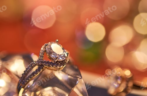 Preview: Close-up view of engagement ring with colorful background