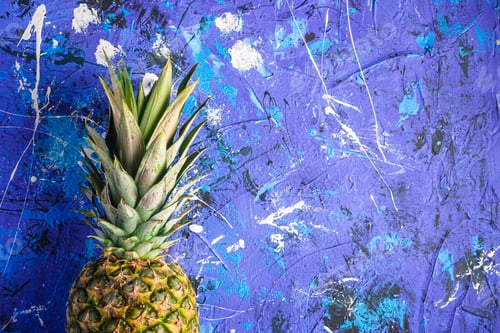 Preview: Fresh sweet pineapple on blue textured background
