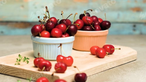 Preview: Red ripe cherries in ceramic bowls