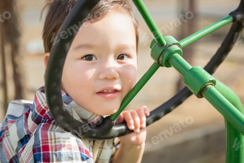 Preview: Mixed Race Young Boy Playing on Tractor