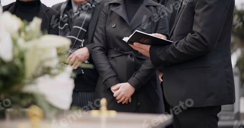 Preview: Bible, hands and family at funeral, cemetery or burial ceremony religion by coffin tomb. Holy book,