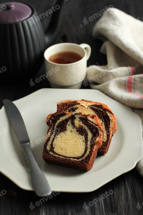 Preview: Three Slice Marble Cake on Cream Plate, Serve with Tea on Black Wooden Background