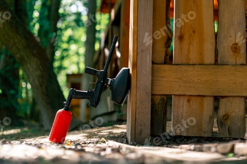 Preview: close up in the wild pintball a gun with red balloon near the wall active recreation active weekend