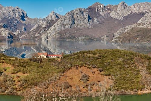 Preview: Beautiful reservoir and mountain landscape in Riano. Mirror effect. Spain